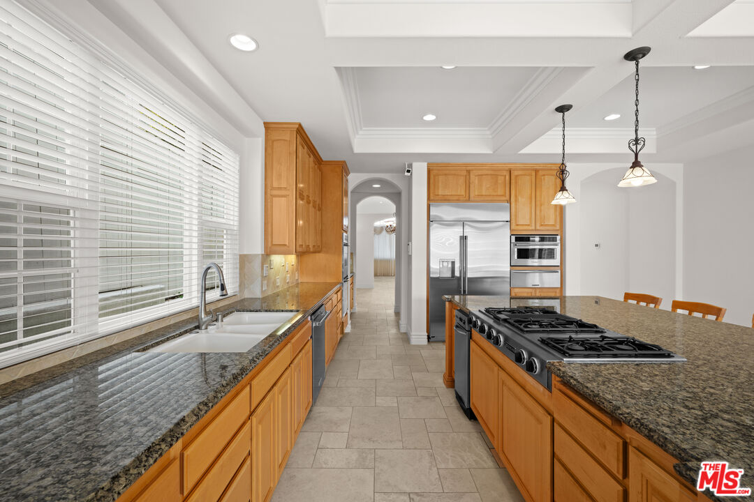 1756 Ruhland Avenue Manhattan Beach, CA 90266 - Photo 32 of 75 a kitchen with stainless steel appliances granite countertop a stove a sink and a refrigerator