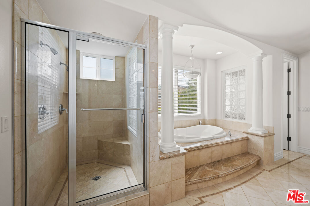 1756 Ruhland Avenue Manhattan Beach, CA 90266 - Photo 46 of 75 a bathroom with a granite countertop tub shower and sink