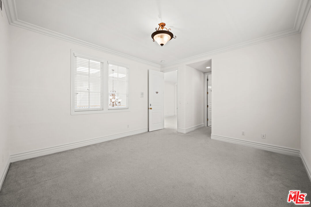 1756 Ruhland Avenue Manhattan Beach, CA 90266 - Photo 48 of 75 an empty room with windows and ceiling fan