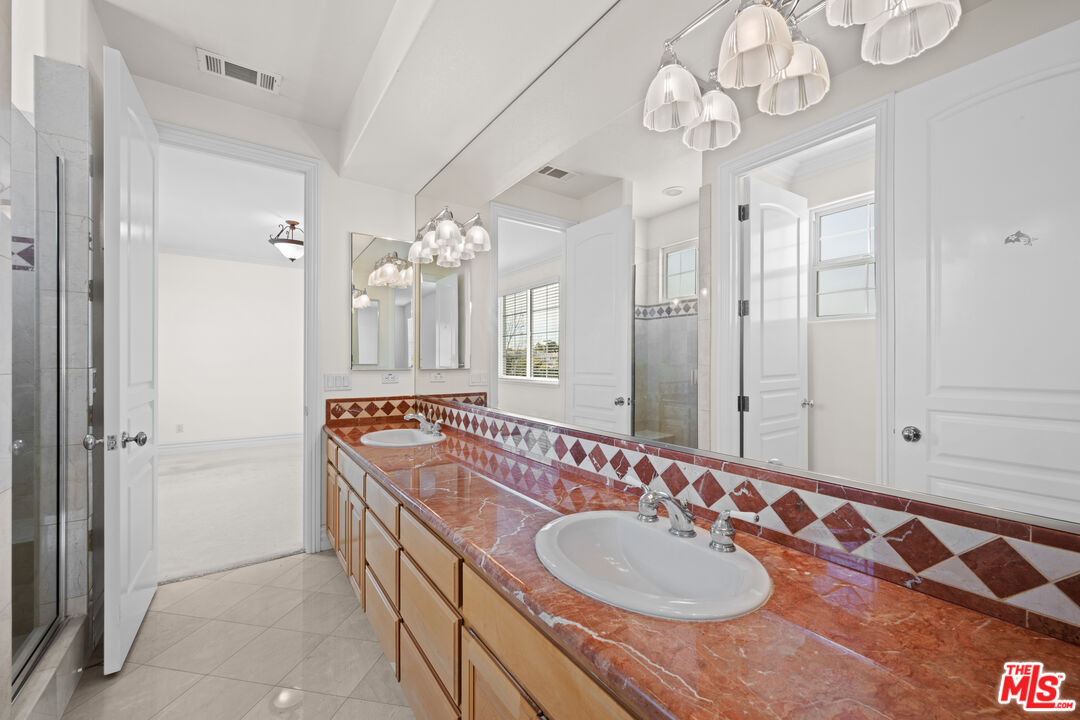 1756 Ruhland Avenue Manhattan Beach, CA 90266 - Photo 54 of 75 a bathroom with a sink double vanity granite tub and a mirror
