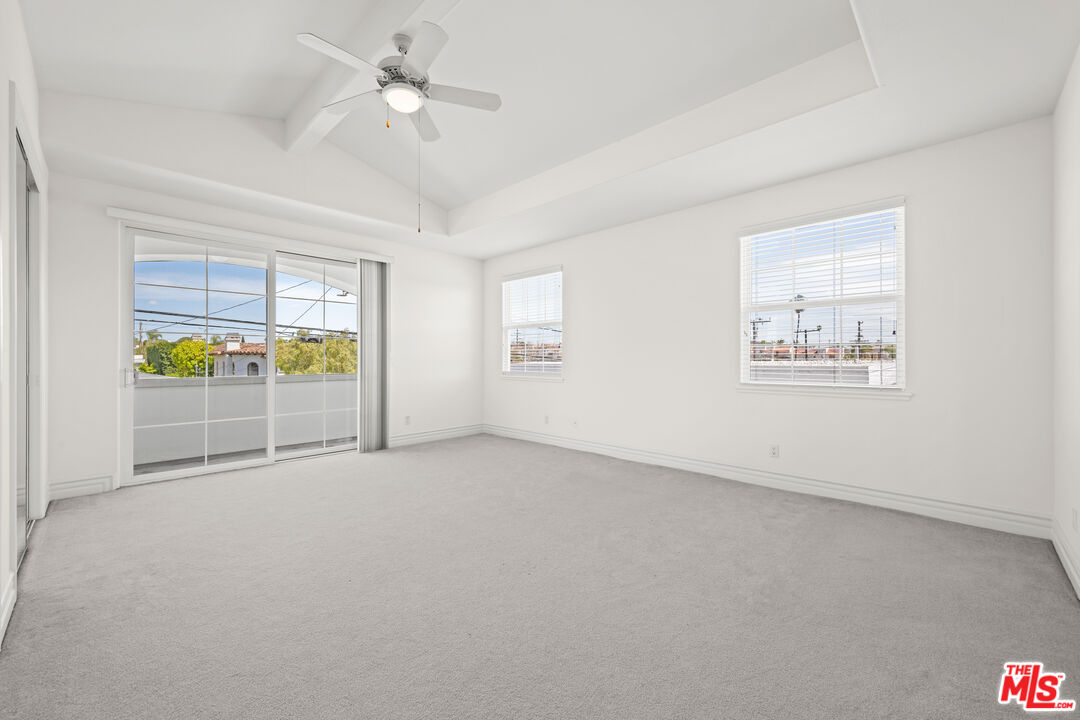 1756 Ruhland Avenue Manhattan Beach, CA 90266 - Photo 55 of 75 an empty room with windows and ceiling fan