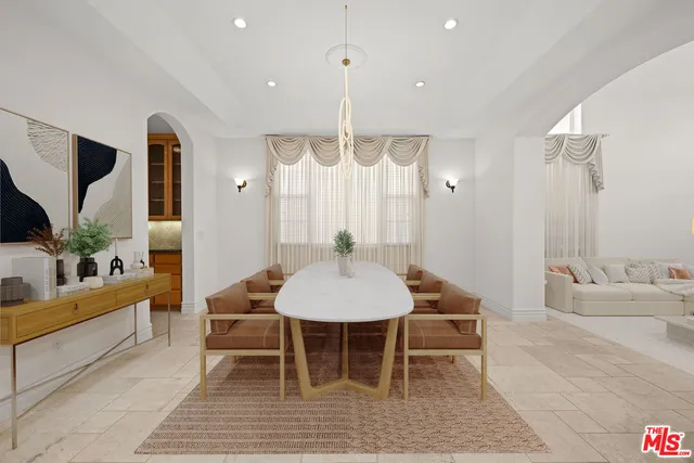 an empty room with windows and fireplace