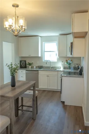 a kitchen with a table and chairs in it