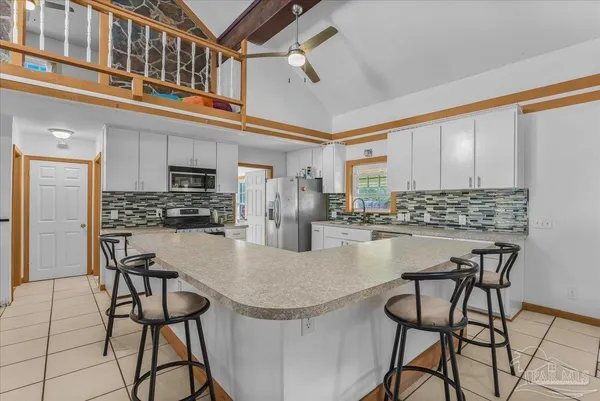a kitchen with a stove and a microwave