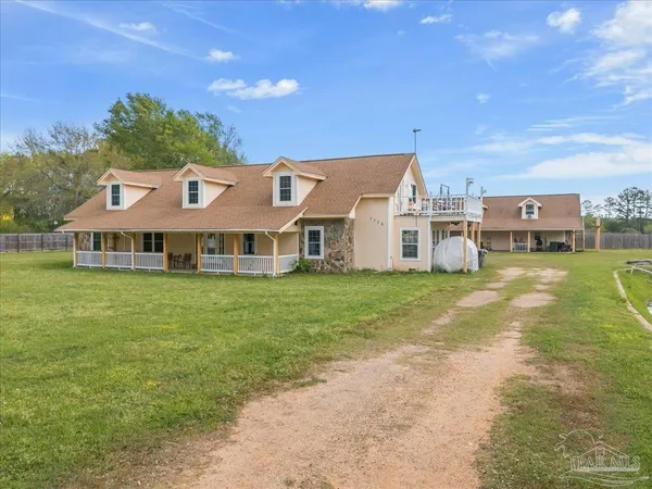 a view of a house with a big yard