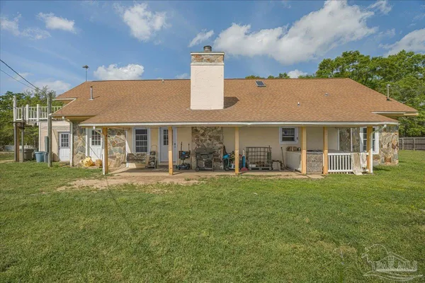 a kitchen with a stove sink and cabinets