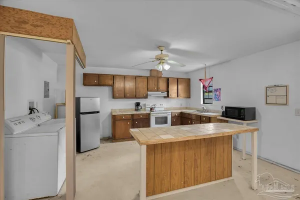 an aerial view of lake and houses with outdoor space