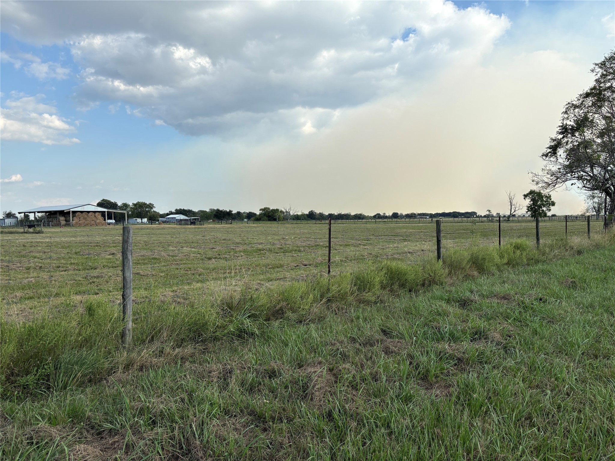 4282 Thompson Road Nome, TX 77629 - Photo 12 of 30 a view of a lake with a big yard