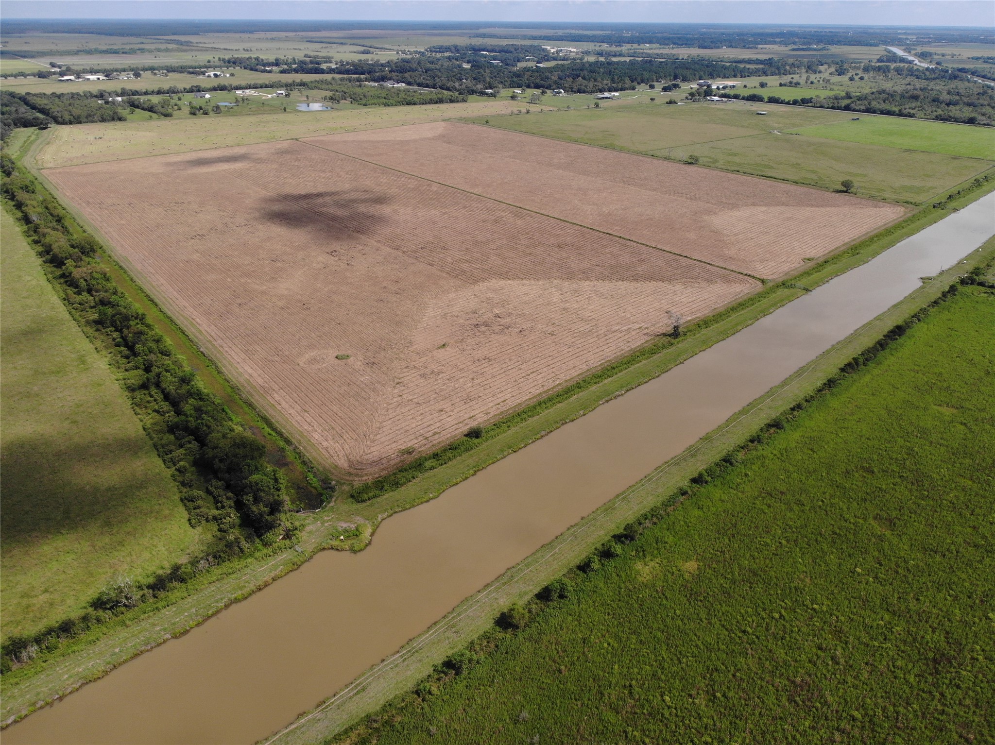4282 Thompson Road Nome, TX 77629 - Photo 2 of 30 a view of a lake with a mountain