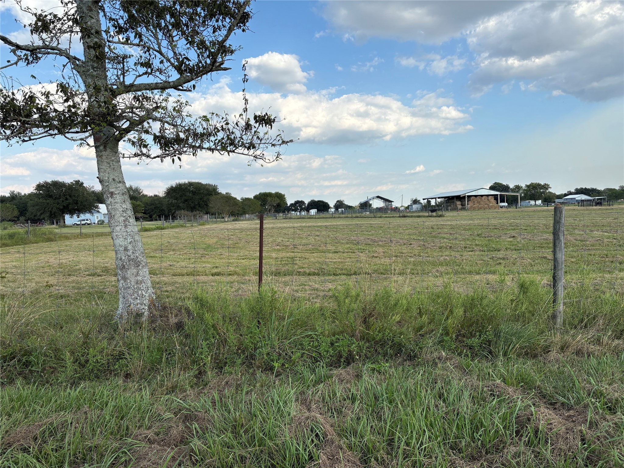 4282 Thompson Road Nome, TX 77629 - Photo 26 of 30 a view of a field with an trees