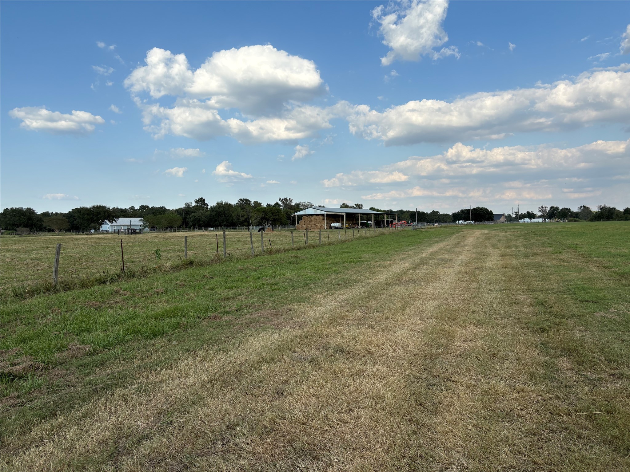 4282 Thompson Road Nome, TX 77629 - Photo 28 of 30 a view of a golf course with a lake