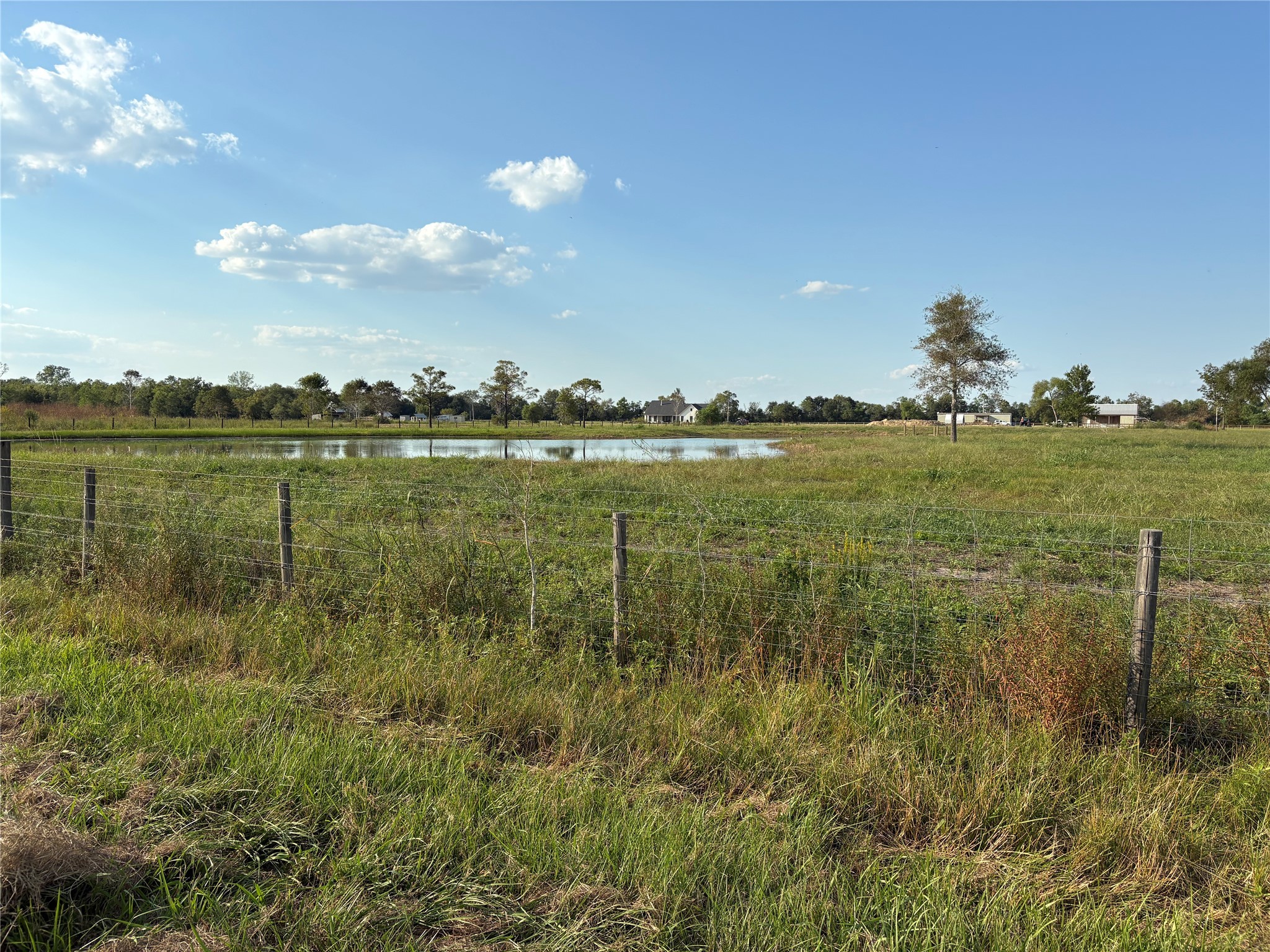 4282 Thompson Road Nome, TX 77629 - Photo 7 of 30 a view of a lake from a yard