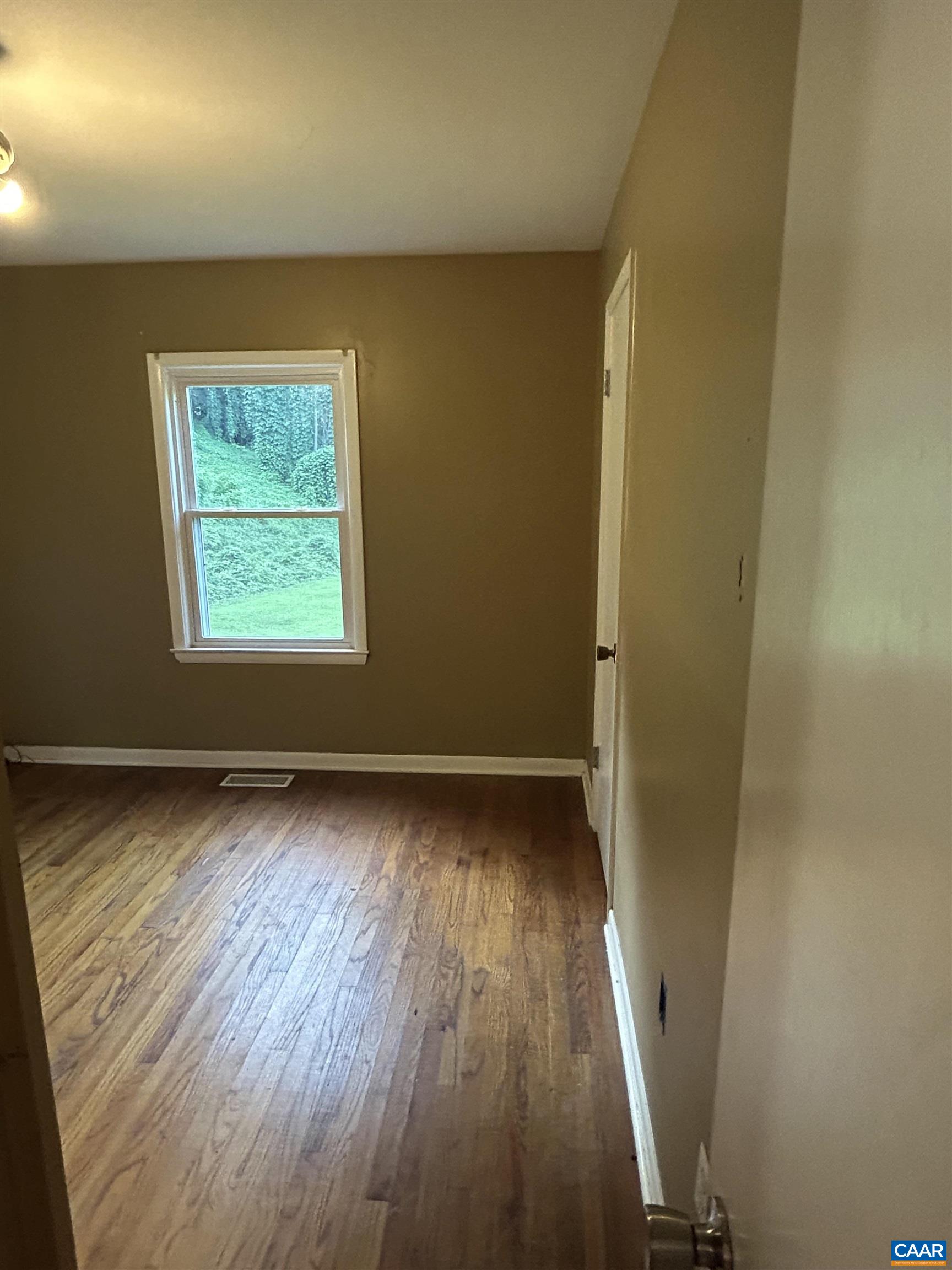 1863 River Road Faber, VA 22938 - Photo 19 of 44 a view of a room with wooden floor and a window