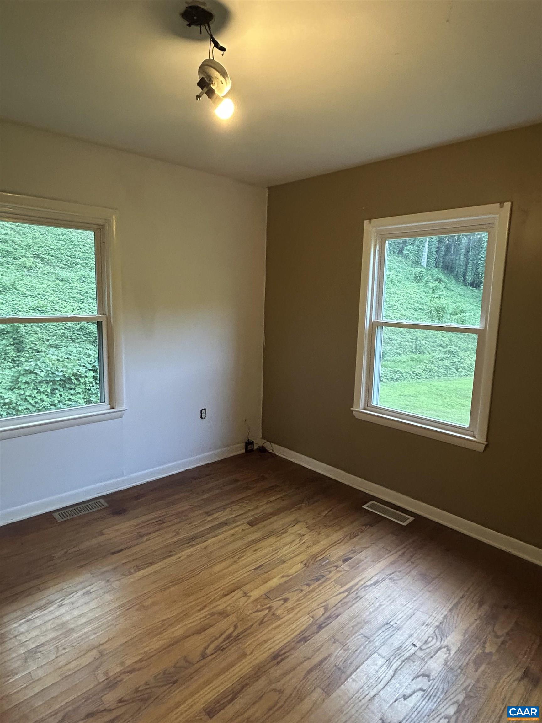 1863 River Road Faber, VA 22938 - Photo 20 of 44 a view of an empty room with wooden floor and a window