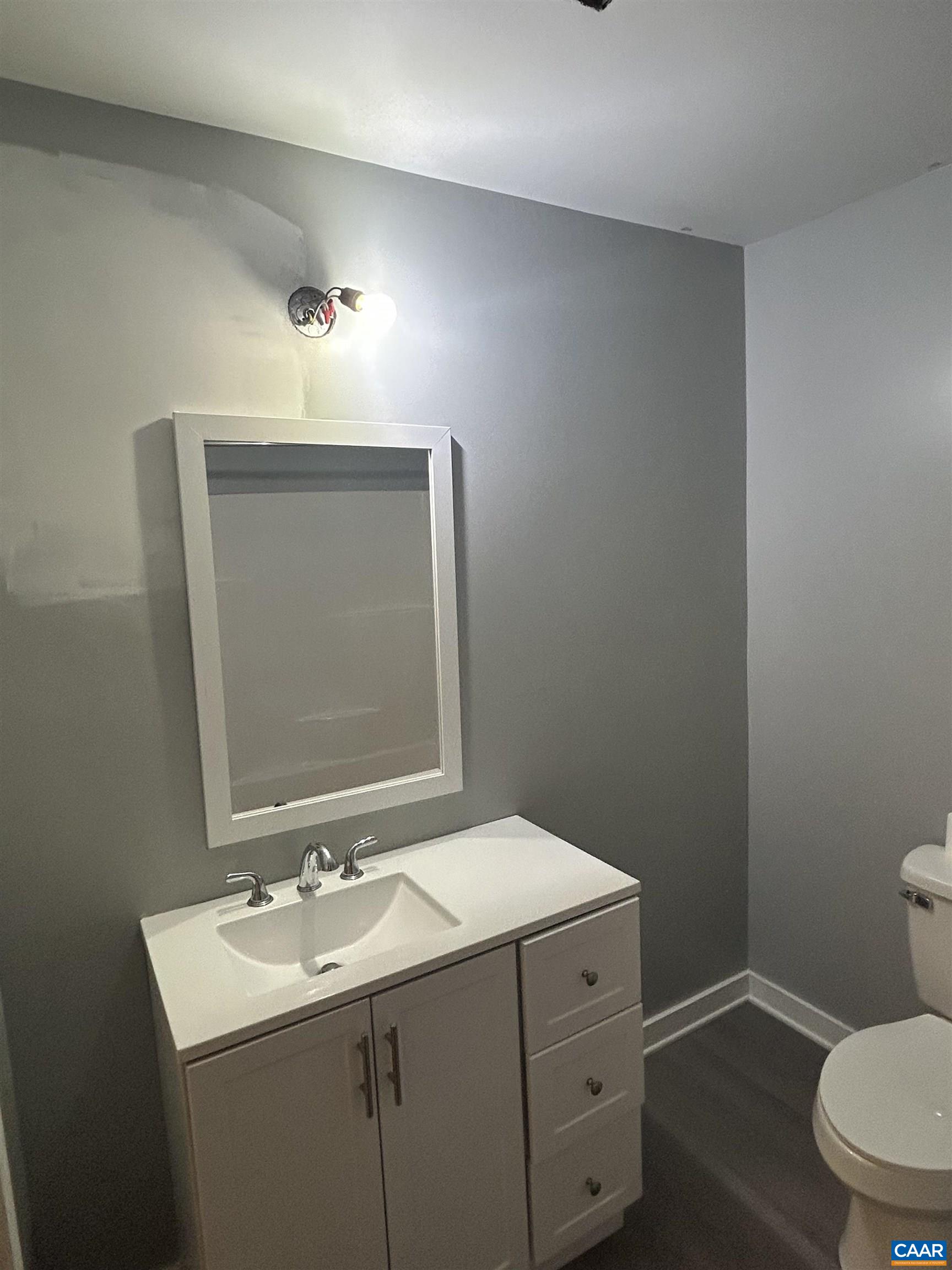 1863 River Road Faber, VA 22938 - Photo 23 of 44 a bathroom with a toilet sink and mirror