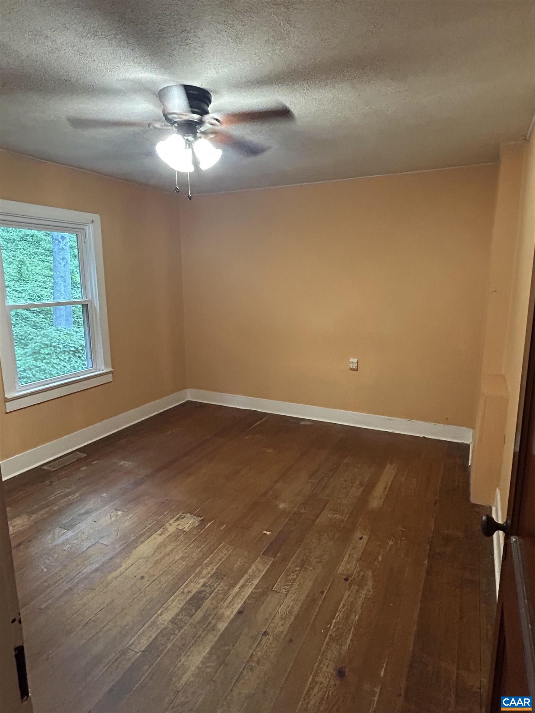 1863 River Road Faber, VA 22938 - Photo 26 of 44 wooden floor in an empty room with a window