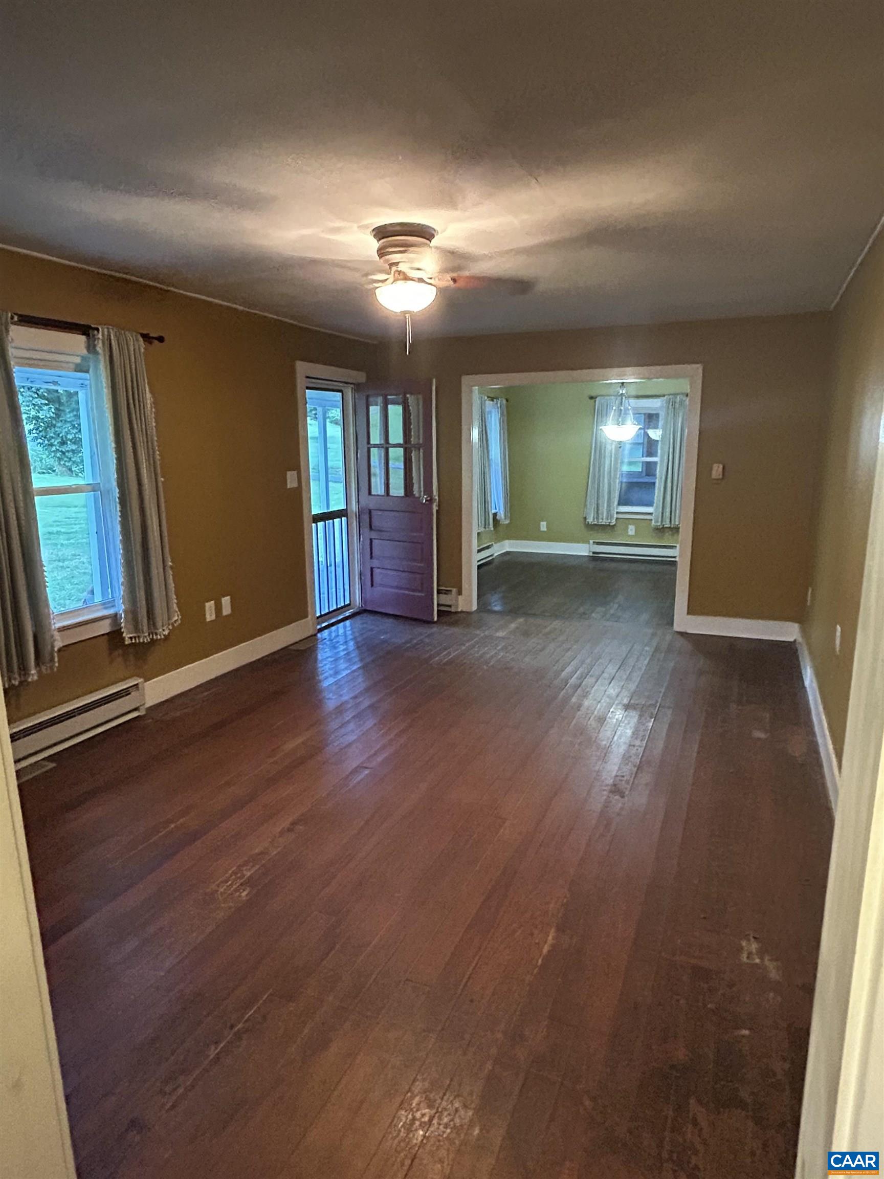 1863 River Road Faber, VA 22938 - Photo 8 of 44 an empty room with wooden floor and windows