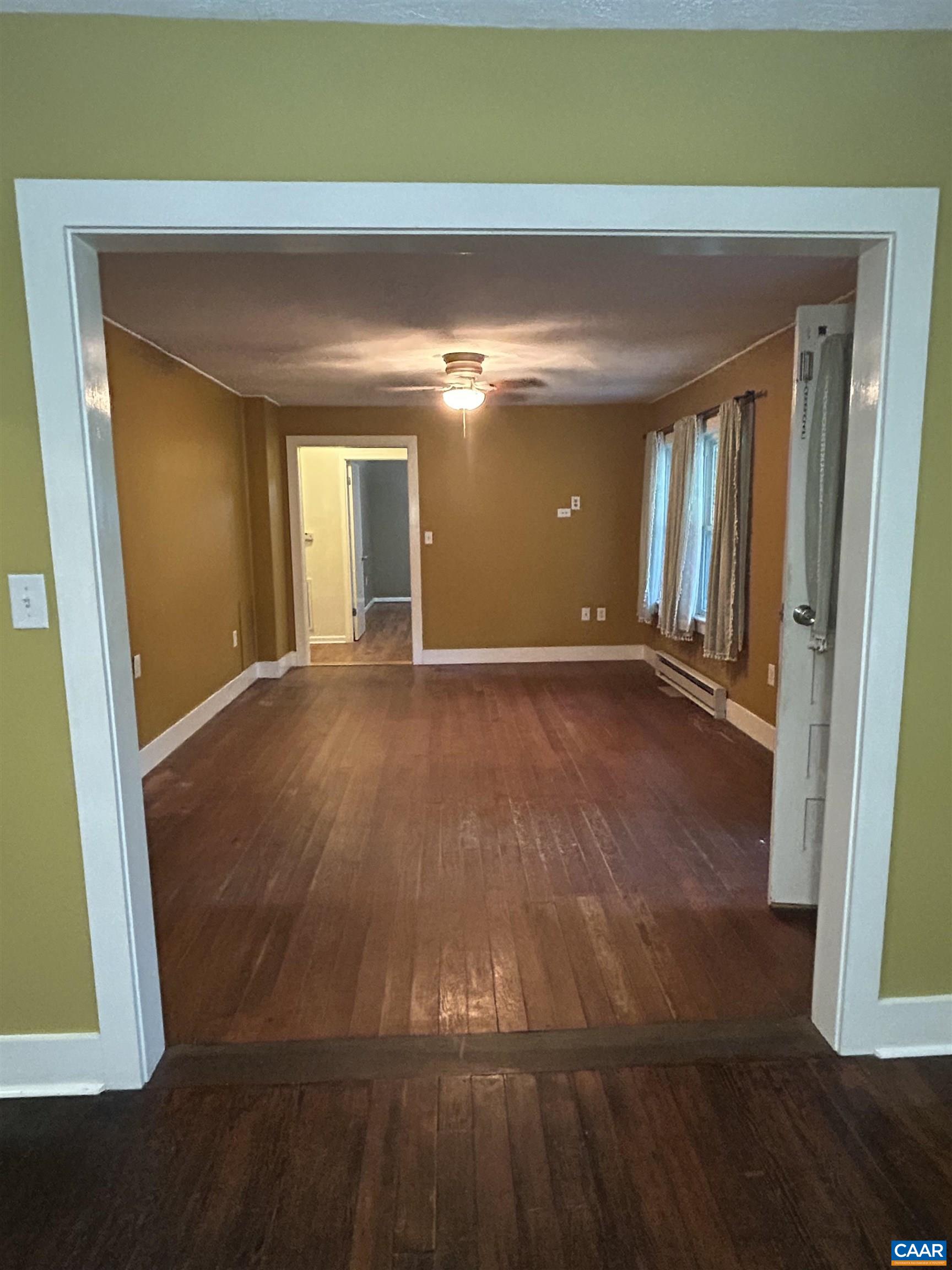 1863 River Road Faber, VA 22938 - Photo 10 of 44 an empty room with wooden floor and windows