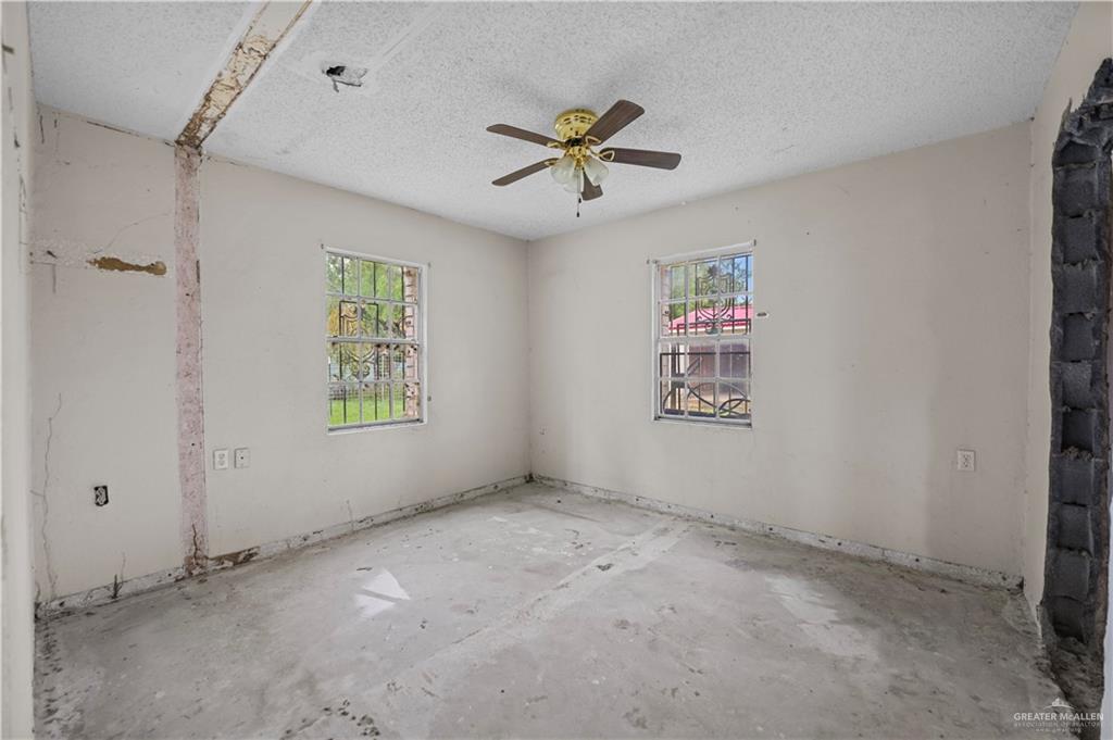 7708 Alberto Road Edinburg, TX 78542 - Photo 12 of 17 a view of an empty room with a window