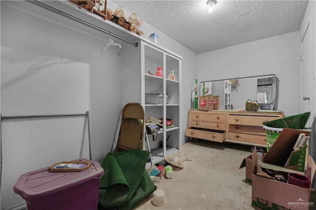 7708 Alberto Road Edinburg, TX 78542 - Photo 14 of 17 a room with furniture and a wooden floor