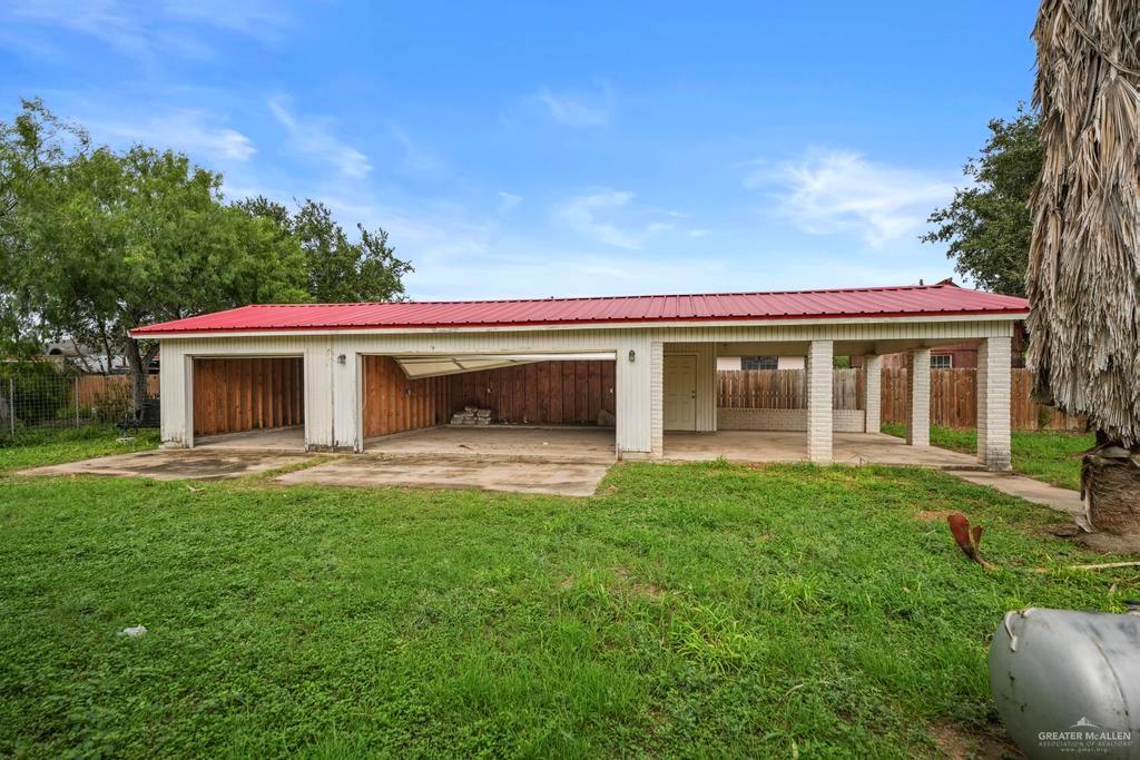 7708 Alberto Road Edinburg, TX 78542 - Photo 5 of 17 a front view of a house with a garden