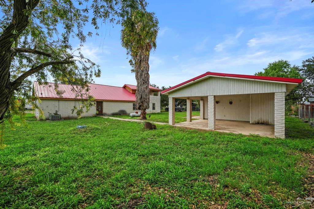 7708 Alberto Road Edinburg, TX 78542 - Photo 7 of 17 a front view of a house with garden