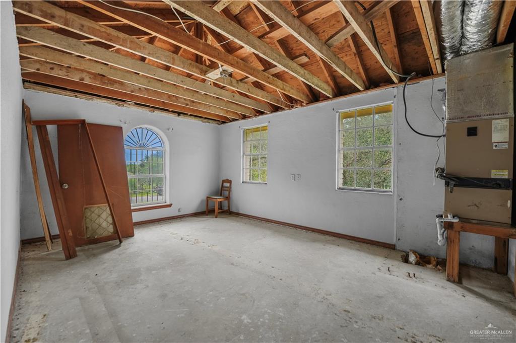 7708 Alberto Road Edinburg, TX 78542 - Photo 9 of 17 a view of an empty room with a window