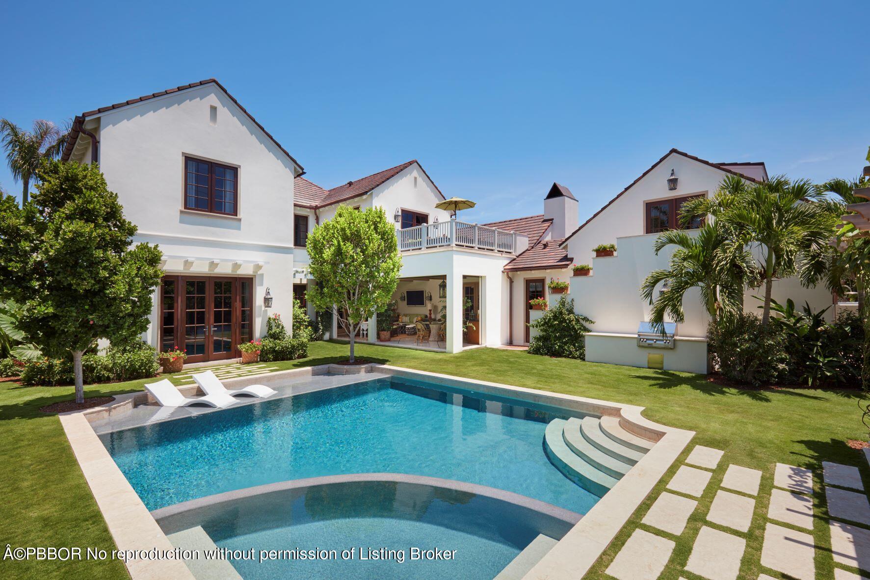 a front view of house with yard and outdoor seating