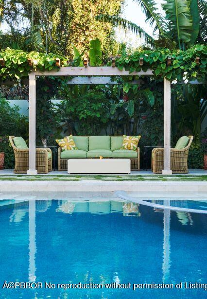 300 Indian Road Palm Beach, FL 33480 - Photo 14 of 42 a view of swimming pool with a patio