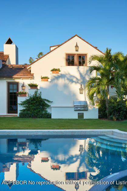 300 Indian Road Palm Beach, FL 33480 - Photo 15 of 42 a front view of a house with a yard