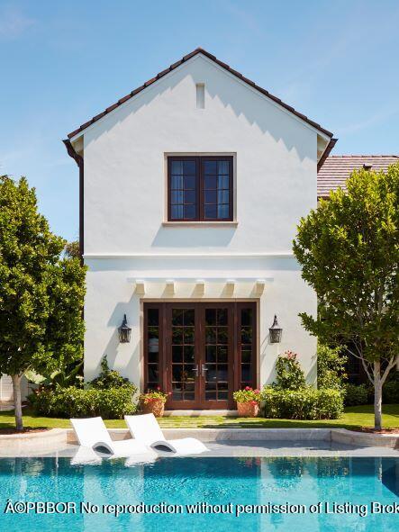 300 Indian Road Palm Beach, FL 33480 - Photo 17 of 42 a front view of a house with a yard