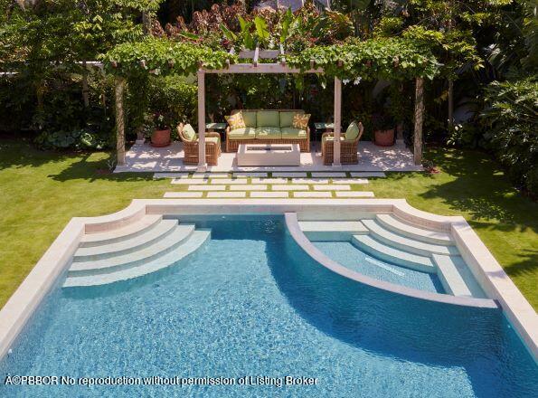 300 Indian Road Palm Beach, FL 33480 - Photo 18 of 42 a view of a swimming pool with lounge chair