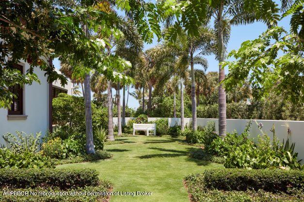 300 Indian Road Palm Beach, FL 33480 - Photo 21 of 42 a garden with trees in front of it