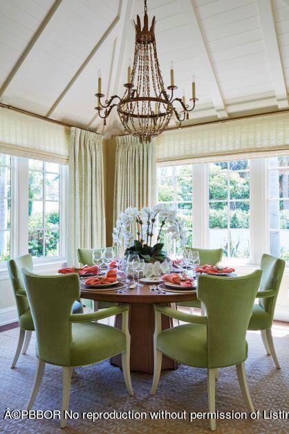 300 Indian Road Palm Beach, FL 33480 - Photo 7 of 42 a dining room with furniture a rug and a chandelier