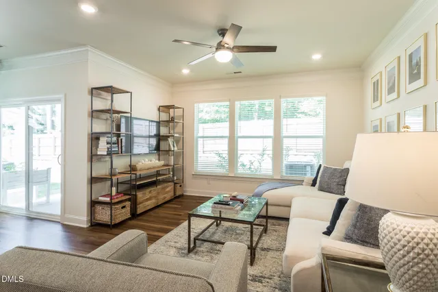 a living room with furniture gym equipment and a window