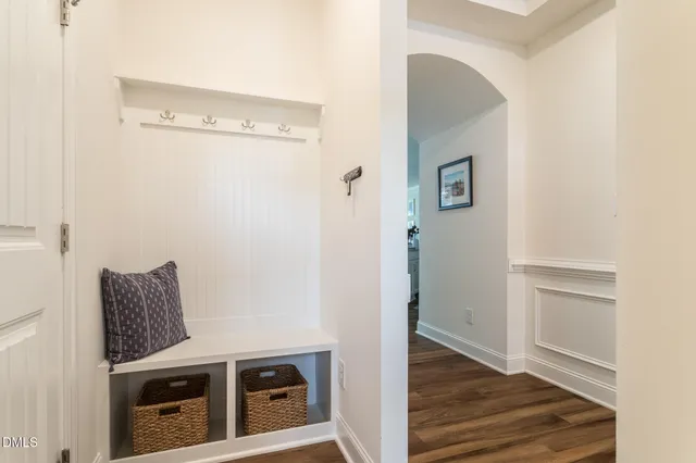 a view of an entryway with wooden floor