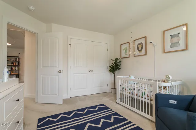 a bedroom with furniture and wooden floor