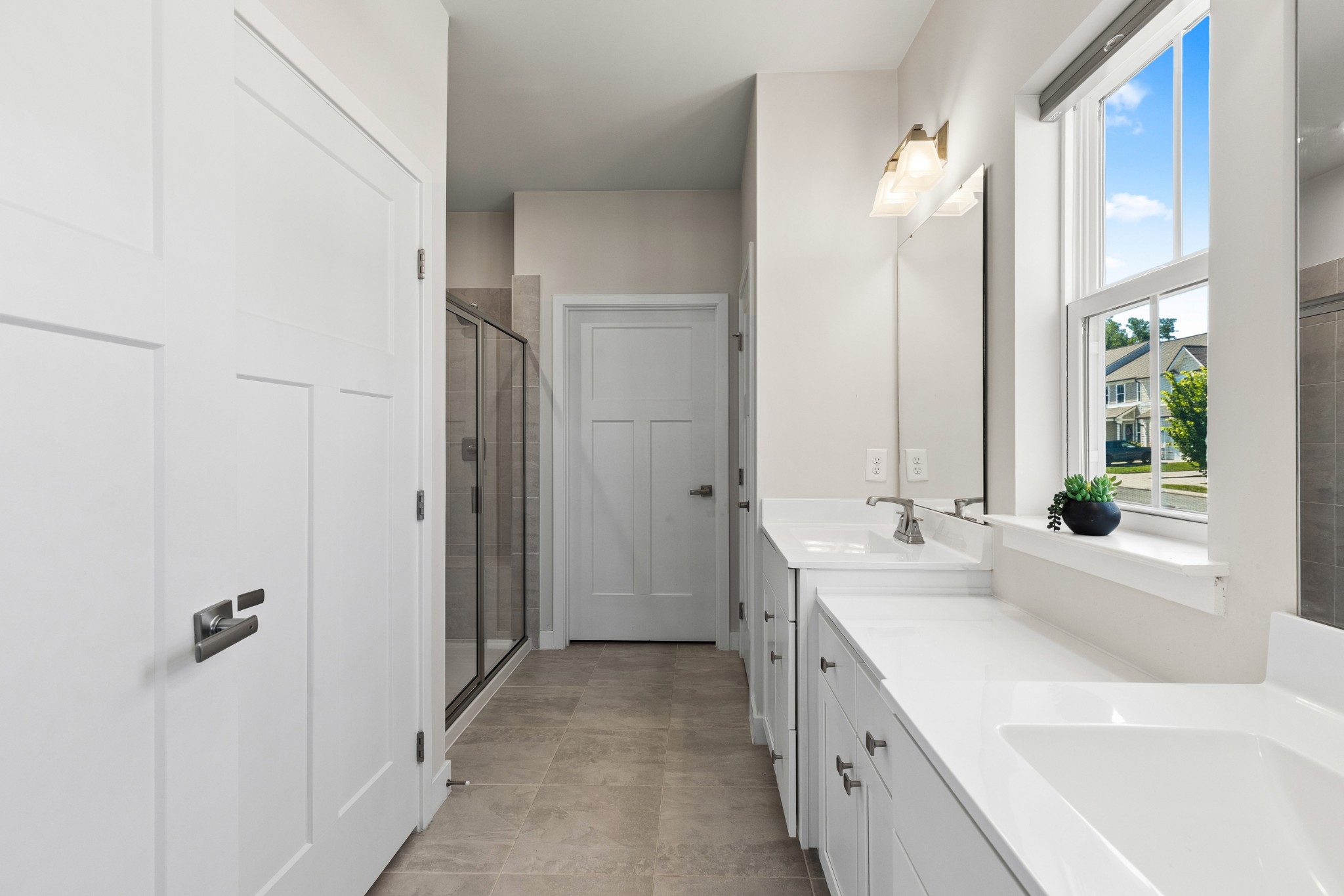 203 Pitchfork Way Gallatin, TN 37066 - Photo 25 of 39 a bathroom with a double vanity sink and mirror with bathtub
