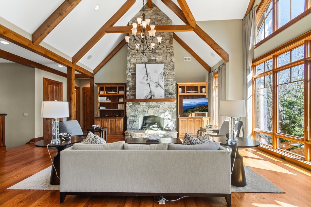 206 Feather Bell Lane Sunset, SC 29685 - Photo 14 of 50 This airy living space features expansive windows and a grand stone fireplace.