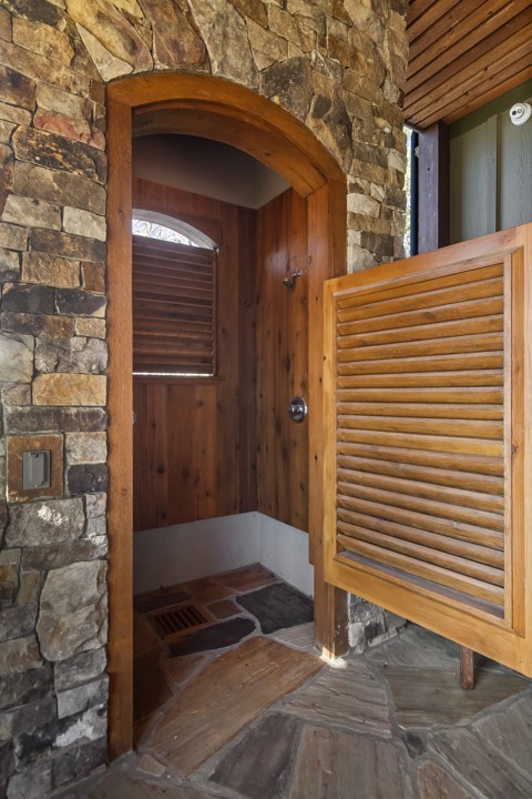 206 Feather Bell Lane Sunset, SC 29685 - Photo 40 of 50 This outdoor shower features a natural stone wall and wood accents for a rustic feel.