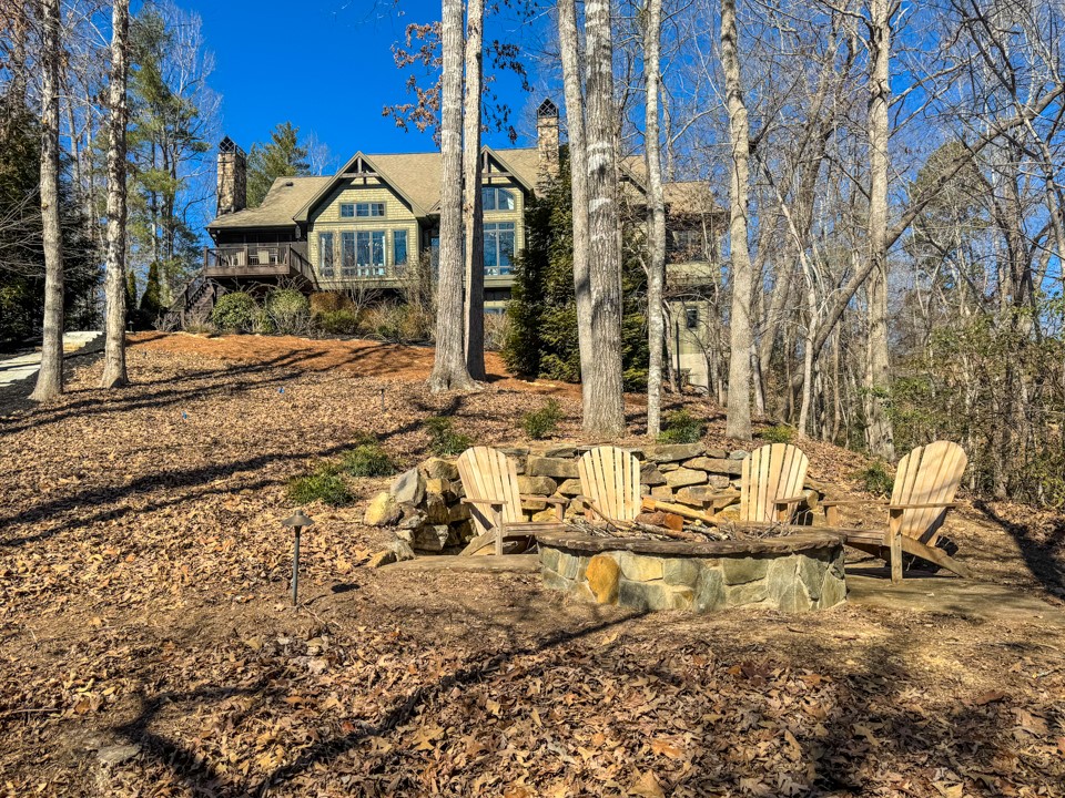 206 Feather Bell Lane Sunset, SC 29685 - Photo 42 of 50 This secluded woodland retreat offers a charming outdoor fire pit, perfect for gatherings under the stars.