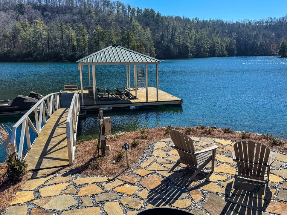 206 Feather Bell Lane Sunset, SC 29685 - Photo 46 of 50 This serene lakefront property offers direct access to the water with a private boat dock and covered slip.