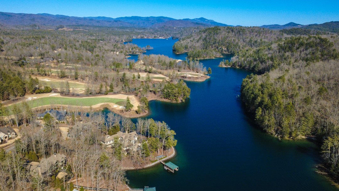 206 Feather Bell Lane Sunset, SC 29685 - Photo 48 of 50 A breathtaking aerial reveals deep blue Lake Keowee winding through rolling mountain terrain, private coves, and manicured golf fairways in a setting that feels both secluded and expansive.