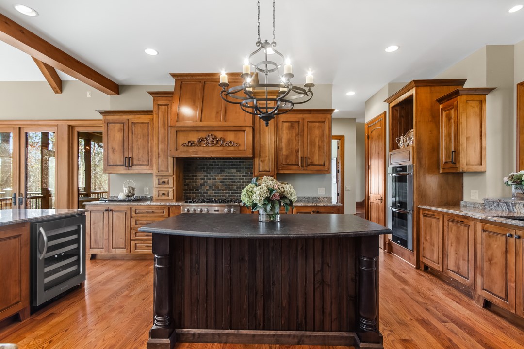 206 Feather Bell Lane Sunset, SC 29685 - Photo 6 of 50 This kitchen features a large island and ample cabinetry, ideal for culinary pursuits.