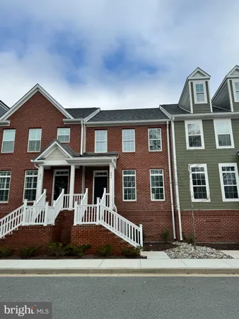 a front view of a house with garage