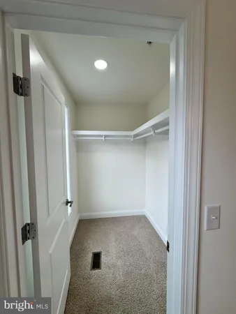a bathroom with a sink and glass door shower