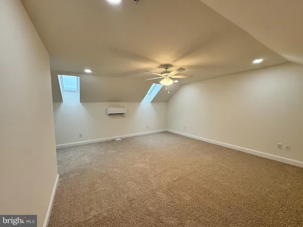 a bathroom with a granite countertop toilet a sink and bathtub
