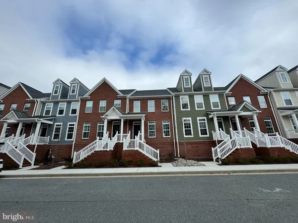 a front view of a residential houses with street view