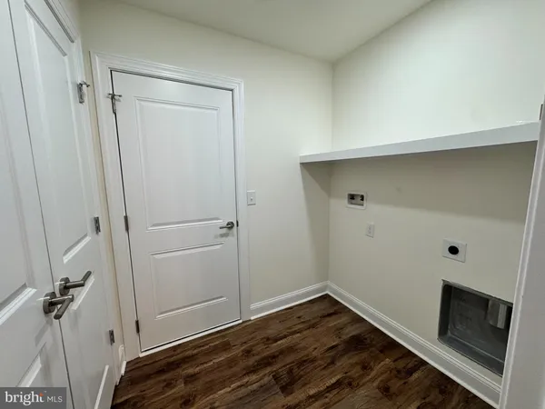 a bathroom with a granite countertop toilet and a shower