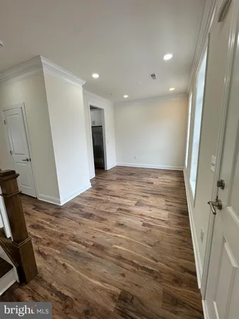 a view of a livingroom with wooden floor